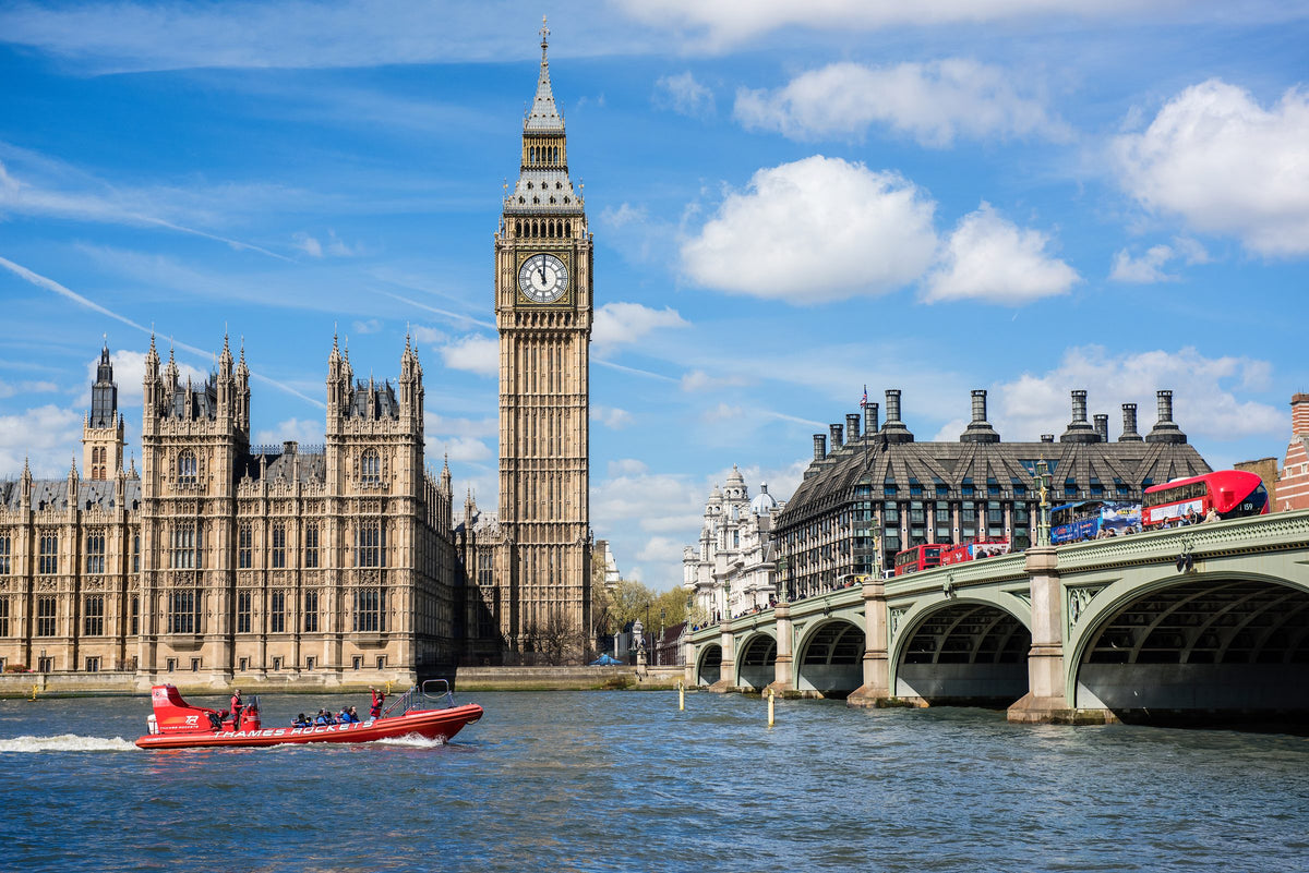 Big Ben and the Houses of Parliament beside Westminster Bridge and the River Thames